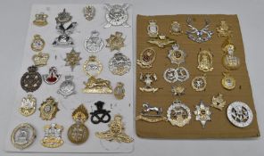 Collection of approximately forty Staybrite badges including Highland Light Infantry, Queen's Own