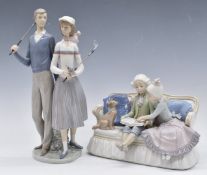 Two Lladro figural groups, one 'Ninos del Sofa' the other two golfers, both boxed, tallest 34cm