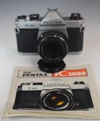 Pentax K1000 35mm SLR camera, with 1:2 50mm lens and instruction booklet