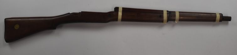 Enfield P14 bolt-action rifle stock stamped 'IR 1914' and other markings, with storage compartment