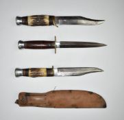 Two hunting knives both with 15cm 'Bowie' style blades, one with sheath, together with a stiletto