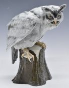 A large continental porcelain Eagle Owl on naturalistic base, printed and incised marks to base