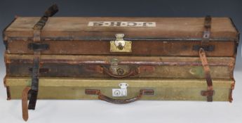 Three canvas and leather shotgun cases, all with fitted interiors and approximately 82x20x9cm.