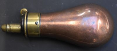 Copper and brass pistol powder flask, 8.8cm long.