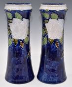 Royal Doulton pair of vases decorated with flowers, impressed BN mark to base, probably Bessie