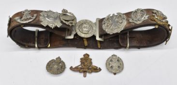 Eighteen cap badges including Rifle Brigade Royal Artillery, Highland Light Infantry, South Wales