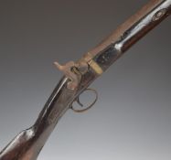 Unnamed 8 bore percussion hammer action gun with chequered grip, metal ram-rod, brass barrel band