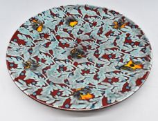 Poole Pottery charger with abstract leaf and berry decoration, diameter 41cm