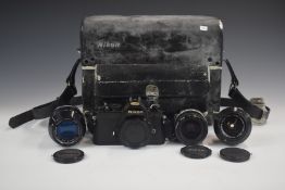 Nikon FM 35mm SLR camera outfit including 35mm 1:2.8, 35mm 1:2  and 135mm 1:3.5 lenses and