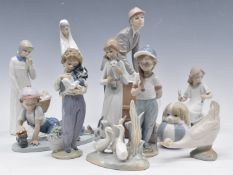 A collection of Lladro, Nao and Cascades figures, tallest 31cm