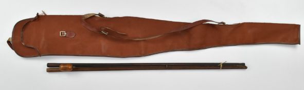 Three gun cleaning rods comprising two wooden examples and a metal example with turned wooden