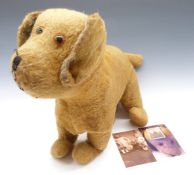 Steiff style blonde mohair dog c1929, with related photograph, H43cm.