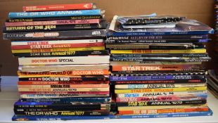 Fifty-four Dr Who, Star Wars and Star Trek book and annuals.