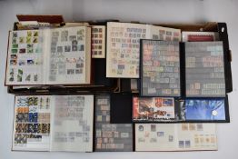 A box of world stamps and first day covers in albums, folders and loose.