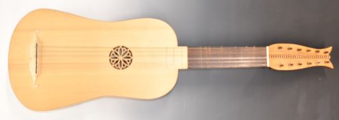 A reproduction Baroque style Vihuela 12 string guitar, retailer's label inside Gordon Saunders,