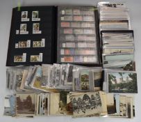 GB and Commonwealth stamps and postcards in a stockbook including Newfoundland, Alderney, Isle of