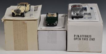 Three Franklin Mint diecast model Jaguar cars comprising SS100, XK 120 1952 and E Type 1961, all