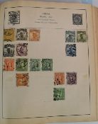 The Centurion stamp album containing a collection of world stamps.