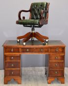 Reproduction leather inset twin pedestal desk fitted nine drawers, with matching chair, desk W121