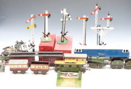 A collection of 0 gauge model railway items including locomotives, coaches, signals etc, some in