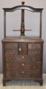 Georgian oak linen or book press, the base fitted seven drawers and central cupboard, W79 x D43 x