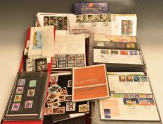 A collection of modern GB first day covers and presentation packs in three folders and loose.