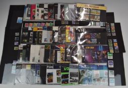 A box file of GB mint stamps in presentation packs. High face value.