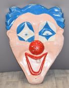 Vintage fairground fibreglass clown mask from above a juvenile ride, height 80cm