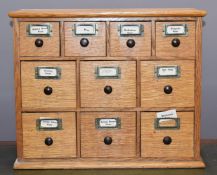 Small oak ten drawer haberdashery unit, W50 x D24 x H41cm