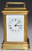 Novelty miniature carriage clock with gilt or brass case and bevelled glass panels, height including
