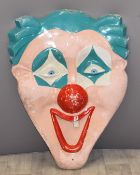 Vintage fairground fibreglass clown mask from above a juvenile ride, height 80cm
