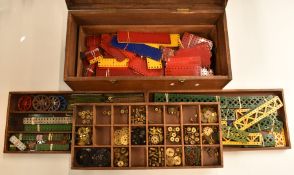 A collection of loose Meccano parts including gears, wheels, braced girder etc, in fitted wooden