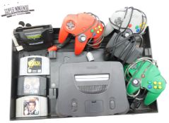 Nintendo N64 vintage video games console with three controller, Xplorer Cheat Cartridge, three games