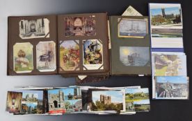 Two albums of early 20thC postcards including steam railway locomotives, cats and dogs, pixies and