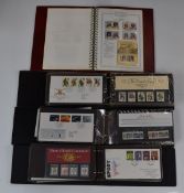 Four stamp albums including first day covers