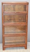 Oak Globe Wernicke style four tier bookcase with up and over glazed doors, W71 x D29 x H134cm