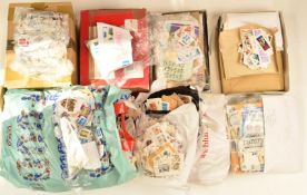 A large quantity of GB and world stamps in albums, kiloware in bags etc
