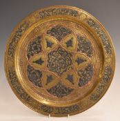 Cairoware style brass charger with applied copper and silver decoration, 32.8cm in diameter.