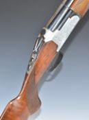 Lanber 12 bore over and under shotgun with engraved locks, chequered semi-pistol grip and forend,