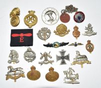 Collection of metal badges including 9th Lancers, Fife and Forfar Yeomanry, Royal Tank Regiment,