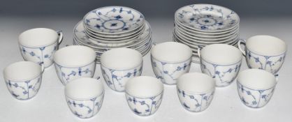 Approximately thirty two pieces of Royal Copenhagen teaware decorated in the Blue Lace pattern
