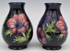 A pair of Moorcroft pedestal vases decorated in the Anemone pattern, H14cm