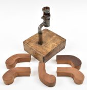 A candlestick in the form of a bayonet mounted in wooden block, together with five mahogany pocket