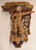 Eastern figural temple bracket with gilt and jewelled decoration, 33cm tall.