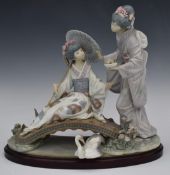 Lladro limited edition of 1500 figure of two Japanese ladies with flowers on a bridge, on wooden