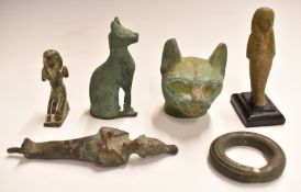 Six ancient Egyptian style bronzes including cats, kneeling pharaoh, shabti etc, largest 13cm tall.