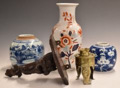 Two Chinese blue and white ginger jars, one decorated with prunus blossom, carved hardwood figural