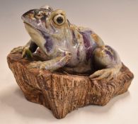 Japanese pottery frog with seal mark impressed to base, 22cm long