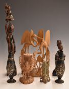 Five Chinese and Eastern carved figures including a Chinese soapstone example, together with a