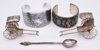 Two Chinese or similar silver rickshaws, Indian or Burmese spoon with deity finial and two